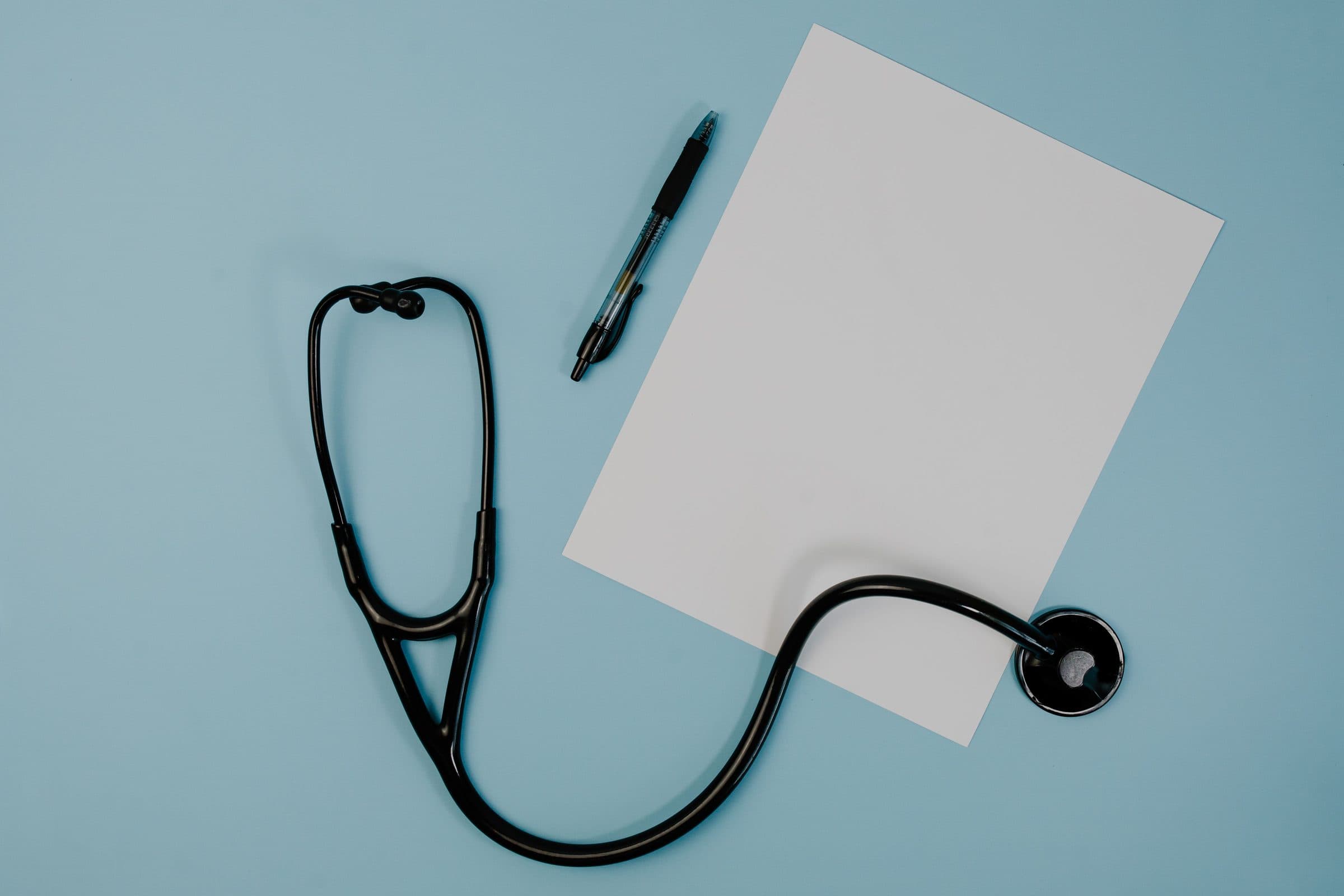 Stethoscope and blood pressure monitor on a desk